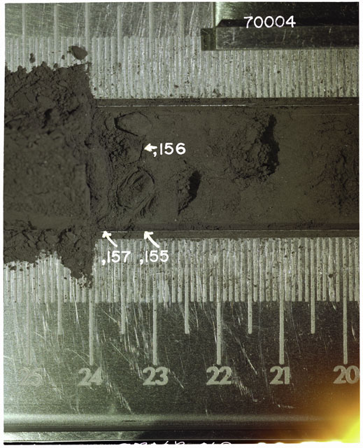 Color photograph of Apollo 17 Sample(s) 70004,155-157; Processing photograph displaying Core Fines in s at 23-24 cm depth.