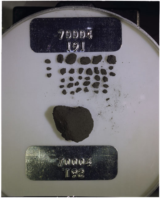 Color photograph of Apollo 17 Sample(s) 70004,191,192; Processing photograph displaying a group of >1 MM Core Fines found at 203.2-203.7 cm depth from surface.