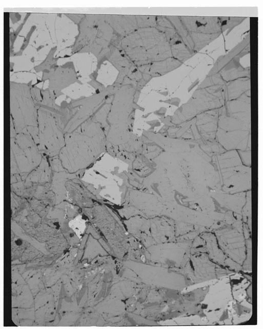 Black and white photograph of Apollo 11 Sample(s) 10058,51; Thin Section photograph using transmitted light.