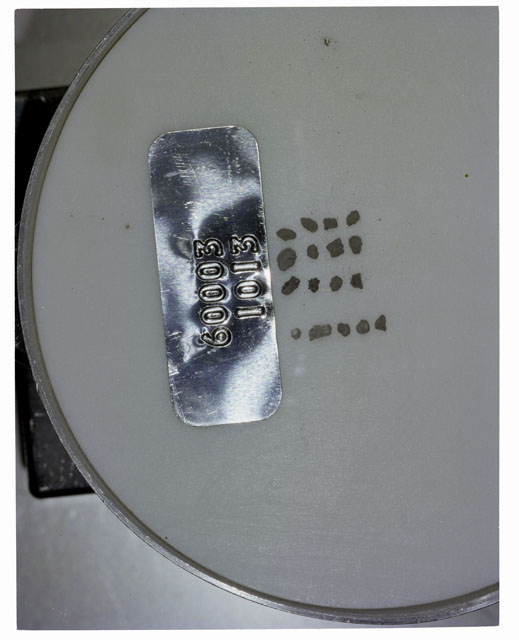 Color photograph of Apollo 16 Core Sample 60003,1013; Processing photograph displaying >1 MM Core Fines .