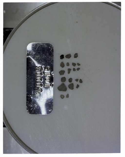 Color photograph of Apollo 16 Core Sample 60003,1015; Processing photograph displaying >1 MM Core Fines .