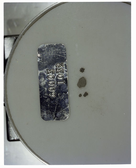 Color photograph of Apollo 16 Core Sample 60003,1032; Processing photograph displaying >1 MM Core Fines .
