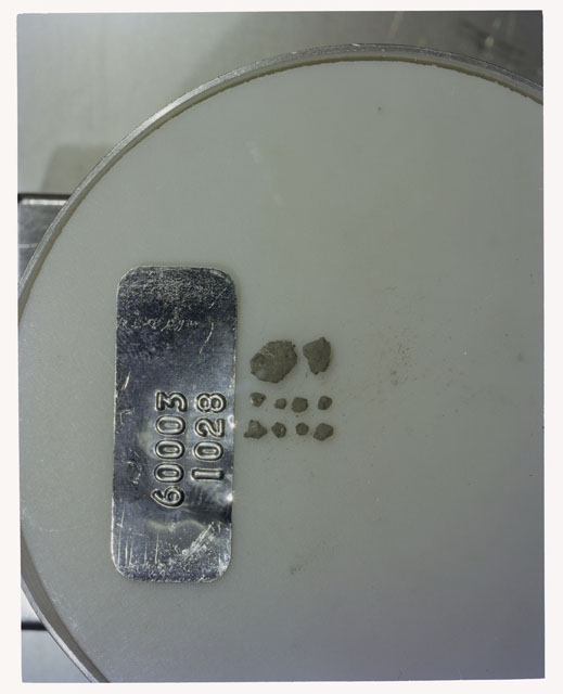Color photograph of Apollo 16 Core Sample 60003,1028; Processing photograph displaying >1 MM Core Fines .