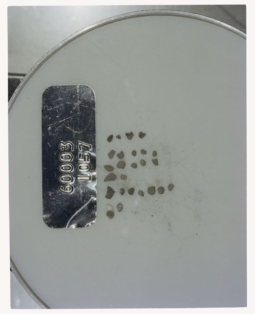 Color photograph of Apollo 16 Core Sample 60003,1057; Processing photograph displaying >1 MM Core Fines .