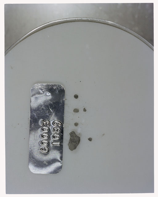 Color photograph of Apollo 16 Core Sample 60003,1089; Processing photograph displaying >1 MM Core Fines .