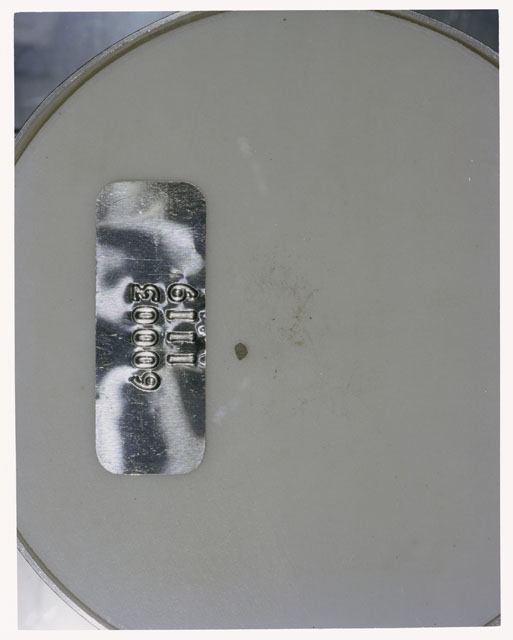 Color photograph of Apollo 16 Core Sample 60003,1119; Processing photograph displaying >1 MM Core Fines .