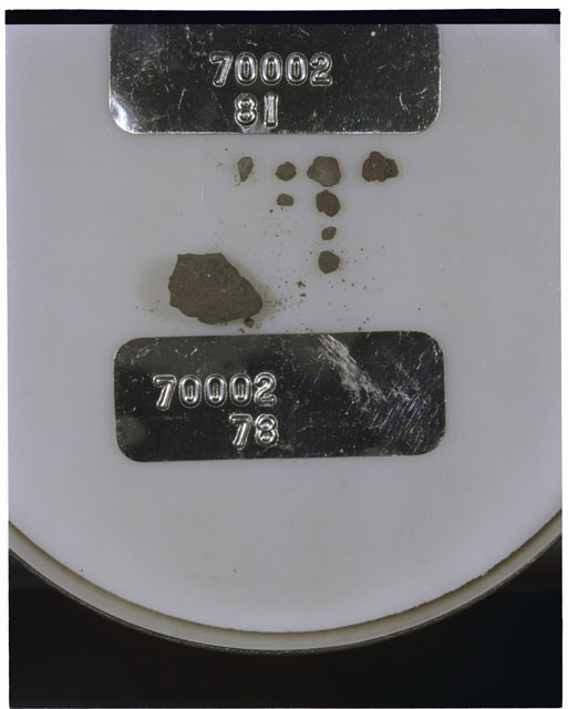 Color photograph of Apollo 17 Sample(s) 70002,81,78; Processing photograph displaying a group of >1 MM Core Fines.