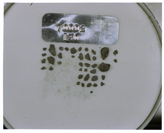 Color photograph of Apollo 17 Sample(s) 70002,130; Processing photograph displaying a group of >1 MM Core Fines.