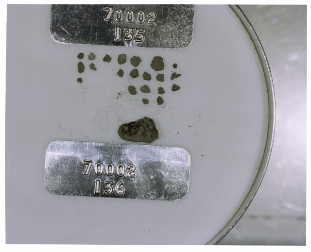Color photograph of Apollo 17 Sample(s) 70002,135,136; Processing photograph displaying a group of >1 MM Core Fines.