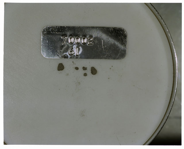 Color photograph of Apollo 17 Sample(s) 70002,61; Processing photograph displaying a group of >1 MM Core Fines.