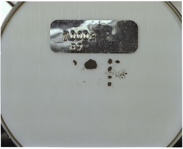 Color photograph of Apollo 17 Sample(s) 70002,89; Processing photograph displaying a group of >1 MM Core Fines.
