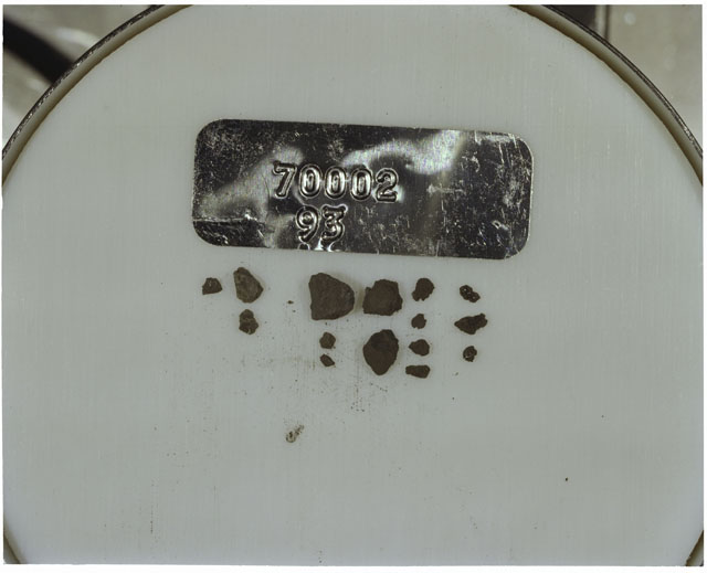 Color photograph of Apollo 17 Sample(s) 70002,93; Processing photograph displaying a group of >1 MM Core Fines.