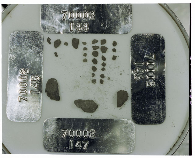 Color photograph of Apollo 17 Sample(s) 70002,144-147; Processing photograph displaying a group of <1 MM Core Fines.