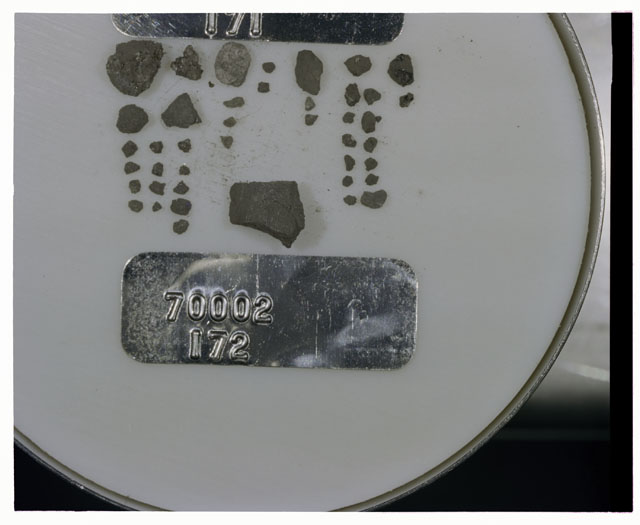 Color photograph of Apollo 17 Sample(s) 70002,172; Processing photograph displaying a group of <1 MM Core fines.