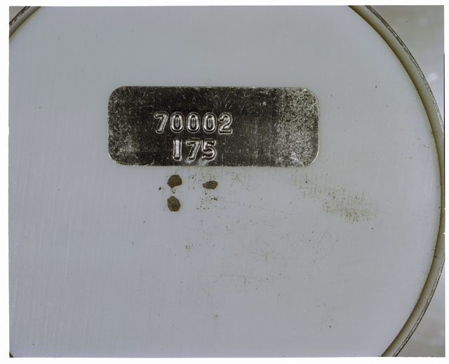 Color photograph of Apollo 17 Sample(s) 70002,175; Processing photograph displaying a group of >1 MM Core Fines.