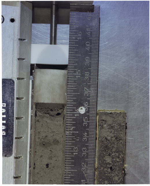 Color photograph of Apollo 17 Sample(s) 70002,179,178; Processing photograph displaying Core with peel at 31-36 cm depth.