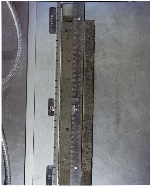 Color photograph of Apollo 17 Sample(s) 70002,179,178; Processing photograph displaying full view of Core with peel.