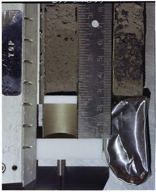 Color photograph of Apollo 17 Sample(s) 70002,179,178; Processing photograph displaying Core with peel at 0-8 cm depth.