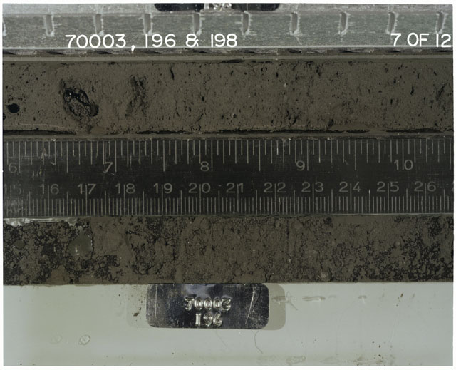 Color photograph of Apollo 17 Sample(s) 70003,196,198; 7 of 12 Processing photograph displaying Core with peel at 15.5-27 cm depth.