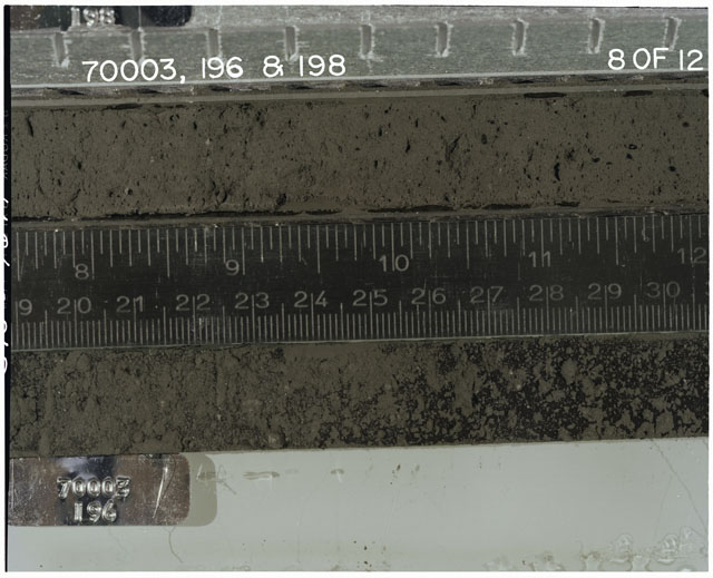 Color photograph of Apollo 17 Sample(s) 70003,196,198; 8 of 12 Processing photograph displaying Core with peel at 20-31 cm depth.