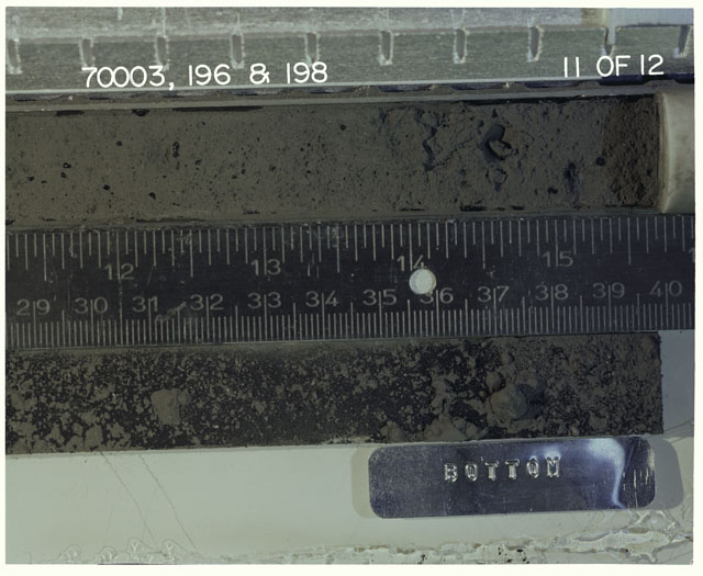 Color photograph of Apollo 17 Sample(s) 70003,196,198; 11 of 12 Processing photograph displaying Core with peel at 29-40 cm depth.
