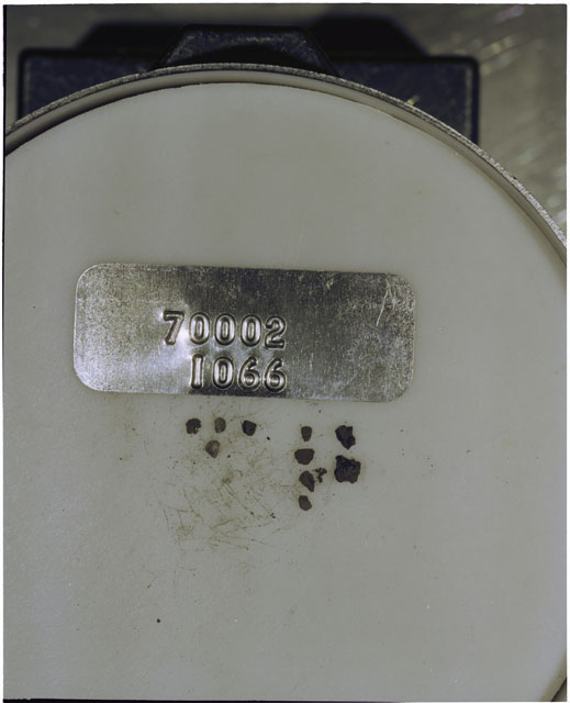 Color photograph of Apollo 17 Sample(s) 70002,1066; Processing photograph displaying a group of >1 MM Core Fines.