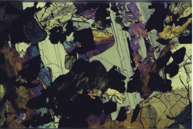 Color 2.7 MM Thin Section photograph of Apollo 17 Sample(s) 70017,125 using cross nichols light.
