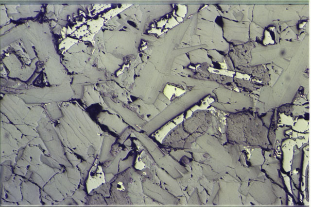 Color photograph of Apollo 11 Sample(s) 10044,55; 2.7 MM Thin Section photograph using reflected light.