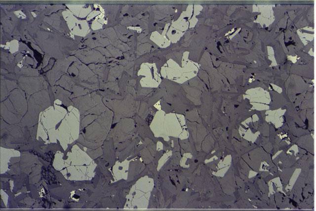 Color photograph of Apollo 11 Sample(s) 10003,152; 2.7 MM Thin Section photograph using reflective light.