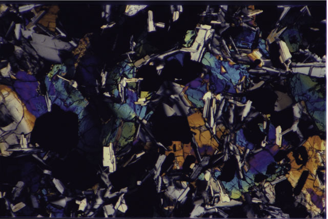 Color photograph of Apollo 11 Sample(s) 10003,152; 2.7 MM Thin Section photograph using cross nichols light.