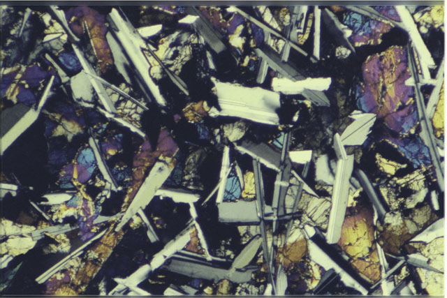 Color 2.7 MM Thin Section photograph of Apollo 12 Sample(s) 12051,54 using cross nichols light.