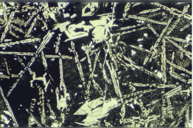 Color 2.7 MM Thin Section photograph of Apollo 12 Sample(s) 12009,6 using transmitted light.