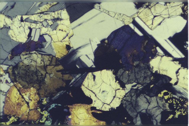 Color 2.7 MM Thin Section photograph of Apollo 12 Sample(s) 12064,8 using cross nichols light.