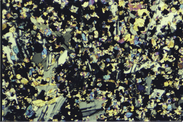 Color photograph of Apollo 11 Sample(s) 10017,20; Thin Section photograph using cross nichols light.