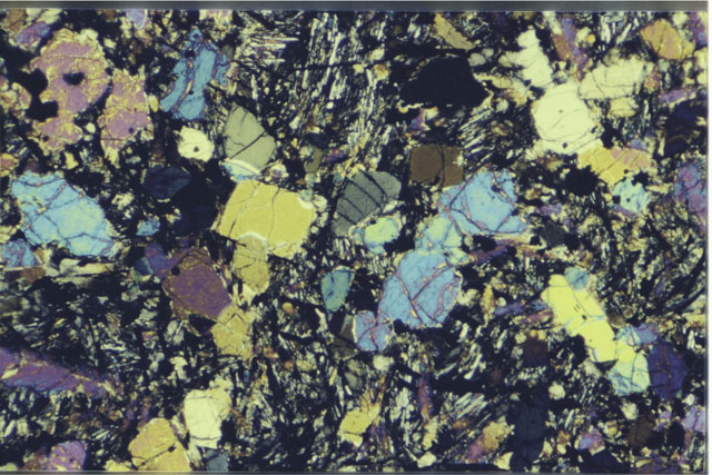 Color 2.7 MM Thin Section photograph of Apollo 12 Sample(s) 12022,9 using cross nichols light.