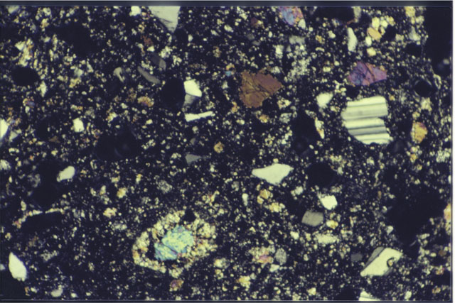 Color 1.4 MM Thin Section photograph of Apollo 14 Sample(s) 14311,93 using cross nichols light.