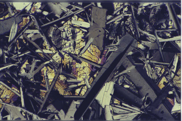 Color 1.4 MM Thin Section photograph of Apollo 14 Sample(s) 14310,173 using cross nichols light.