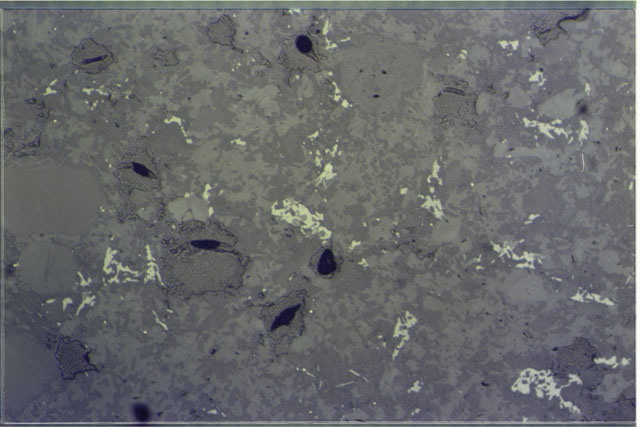 Color photograph of Apollo 17 Sample(s) 76015,9; 1.4 MM Thin Section photograph using reflected light.