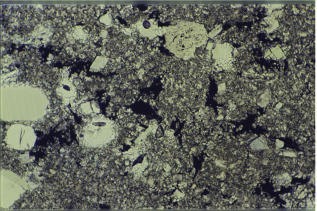 Color photograph of Apollo 17 Sample(s) 76015,9; .69 MM Thin Section photograph using reflected light.