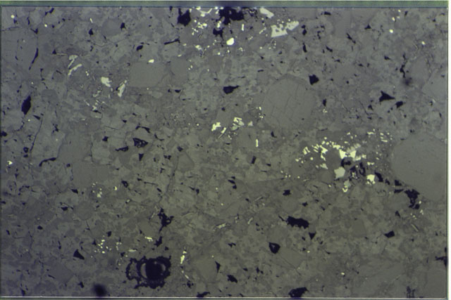 Color photograph of Apollo 16 Sample(s) 65015,13; 1.4 MM Thin Section photograph using reflected light.