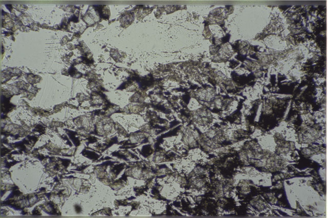 Color photograph of Apollo 16 Sample(s) 61016,220; 1.4 MM Thin Section photograph using transmitted light.