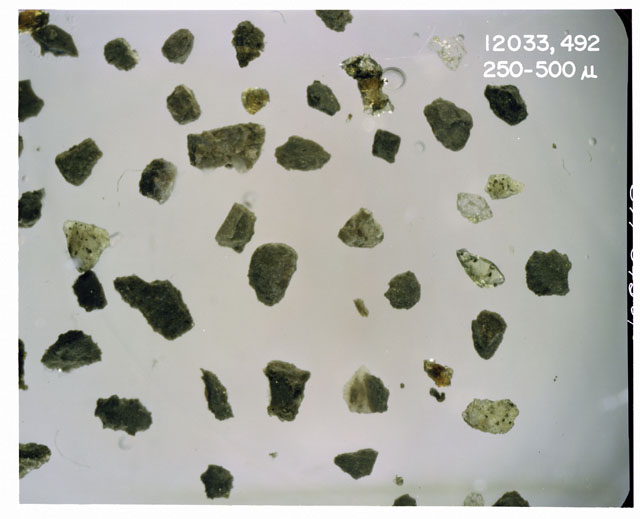 Color photograph of Apollo 12 sample 12033,492; Processing photograph displaying soil grains measuring 250-500 microns.