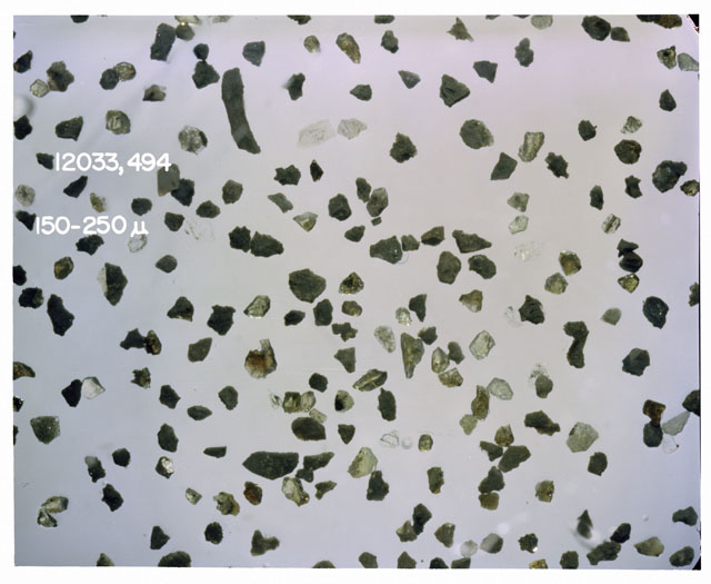 Color photograph of Apollo 12 sample 12033,494; Processing photograph displaying soil grains measuring 150-250 microns.