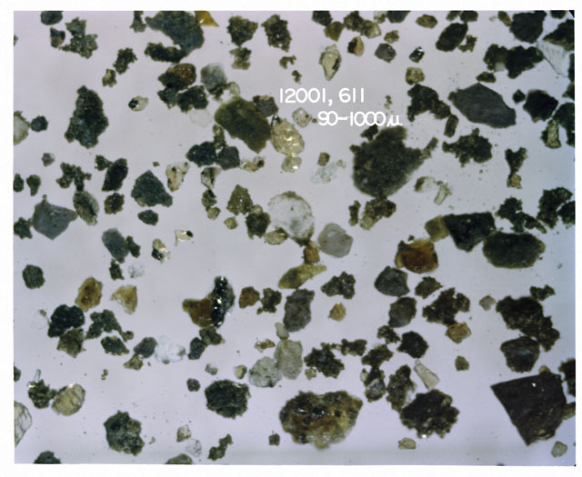 Black and white photograph of Apollo 12 sample 12001,611; Processing photograph displaying soil grains measuring 90-1000 microns.