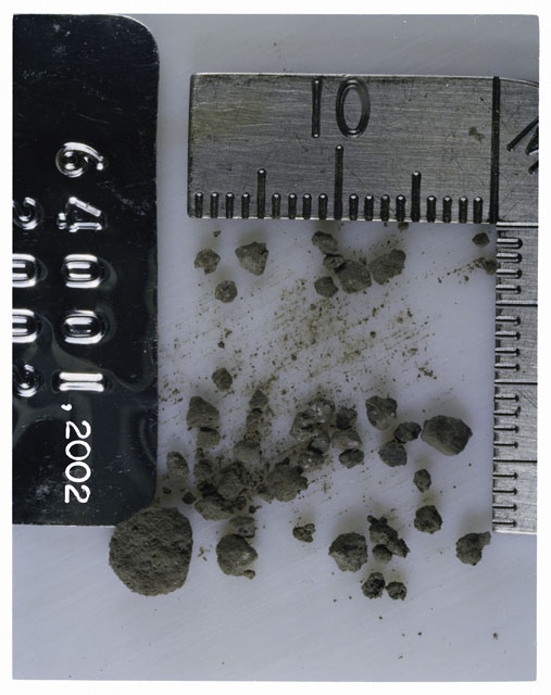 Color photograph of Apollo 16 Core Sample 64001,2002; Processing photograph displaying >1 MM Core Fines .