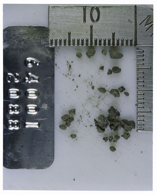 Color photograph of Apollo 16 Core Sample 64001,2088; Processing photograph displaying >1 MM Core Fines .