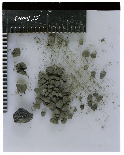 Color photograph of Apollo 16 Core Sample 64001,15; Processing photograph displaying >1 MM Core Fines .