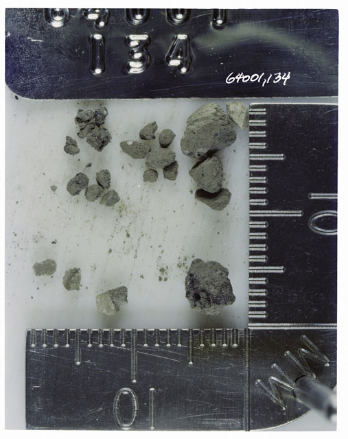 Color photograph of Apollo 16 Core Sample 64001,134; Processing photograph displaying >1 MM Core Fines .