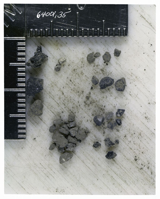 Color photograph of Apollo 16 Core Sample 64001,35; Processing photograph displaying >1 MM Core Fines .