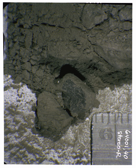 Color photograph of Apollo 16 Core Sample 64001,40; Right Stereo photograph displaying in situ Core Fines .